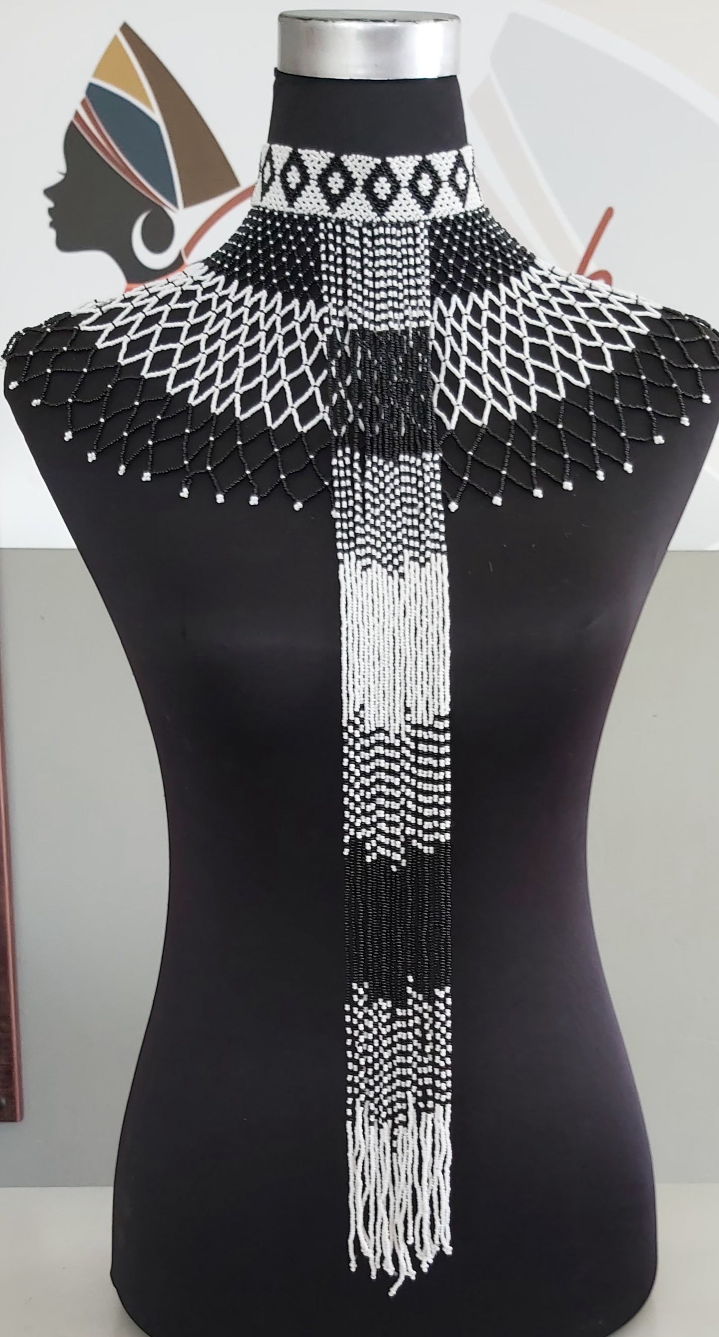 Webneckpiece with tassels